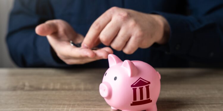 Gráfico de orçamento público em frente a uma prefeitura ilustrando a saúde fiscal dos municípios brasileiros e seus principais indicadores financeiros.